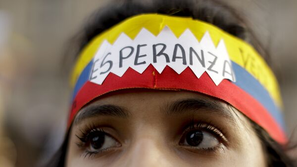 Una manifestante venezolana - Sputnik Mundo