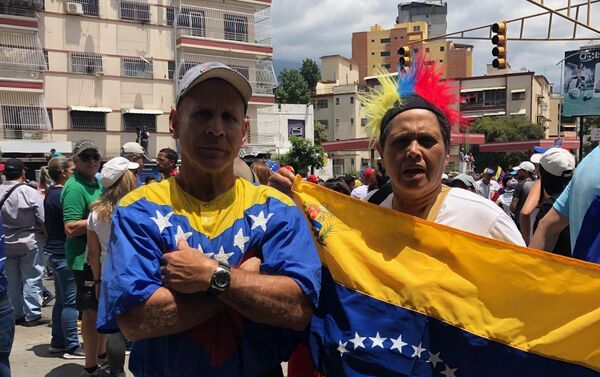 Participantes de la marcha opositora en Caracas - Sputnik Mundo