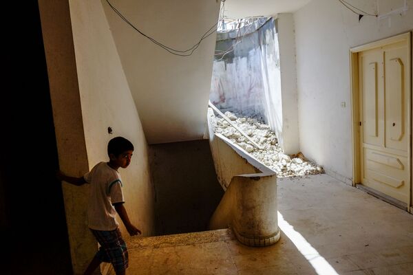 Мальчик из семьи сирийских беженцев в одном из домов в Хальбе, Ливан - Sputnik Mundo