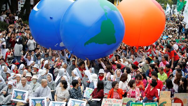 Participantes de una protesta contra el cambio climático en Corea del Sur - Sputnik Mundo