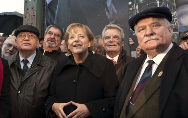Angela Merkel durante las conmemoraciones por los 20 años de la caída del Muro de Berlín - Sputnik Mundo