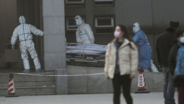 Médicos chinos en el hospital donde están los contagiados con el coronavirus - Sputnik Mundo