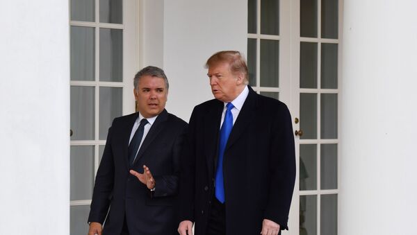 El presidente de Colombia, Iván Duque, junto a su homólogo estadounidense, Donald Trump - Sputnik Mundo