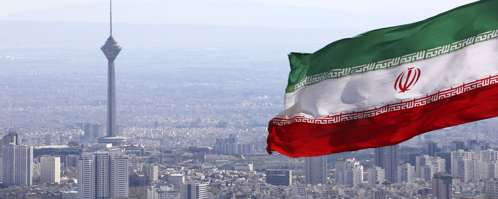 La bandera de Irán en la ciudad de Teherán - Sputnik Mundo, 1920, 30.12.2021