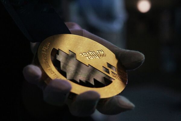Una medalla de oro de los Juegos Olímpicos de Sochi 2014 - Sputnik Mundo