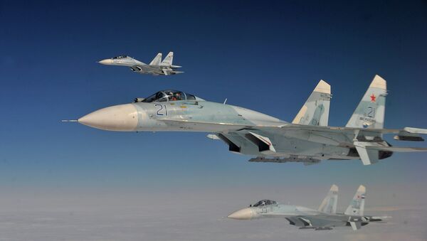 Russian Federation Air Force Su-27 aircraft intercept a simulated hijacked aircraft entering Russian airspace Aug. 27, 2013 - Sputnik Mundo